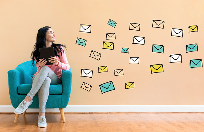 Woman Looking at Graphic Envelopes