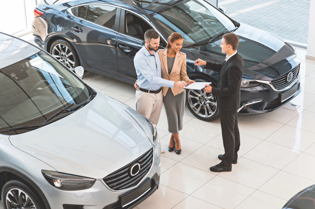 Screen Shot 2021-07-22 at 11.08.33 AM Couple Reviewing an Auto Loan in a Dealership