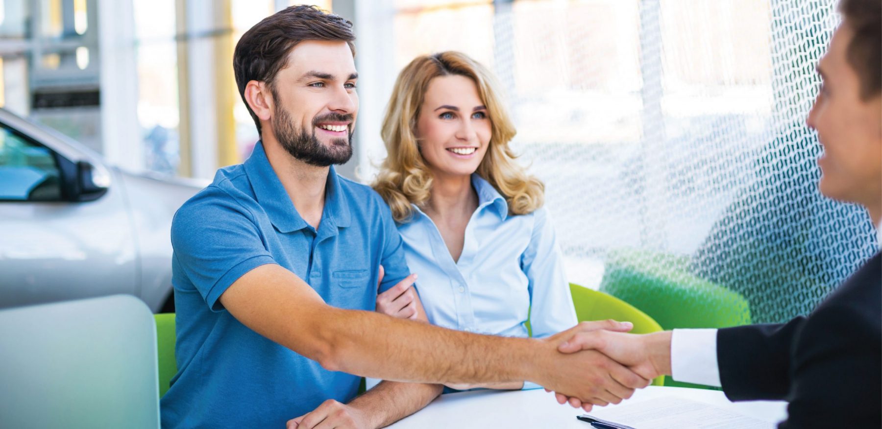 Couple Accepting an Auto Loan