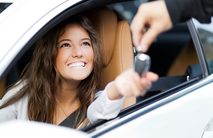 Happy Woman in a Car