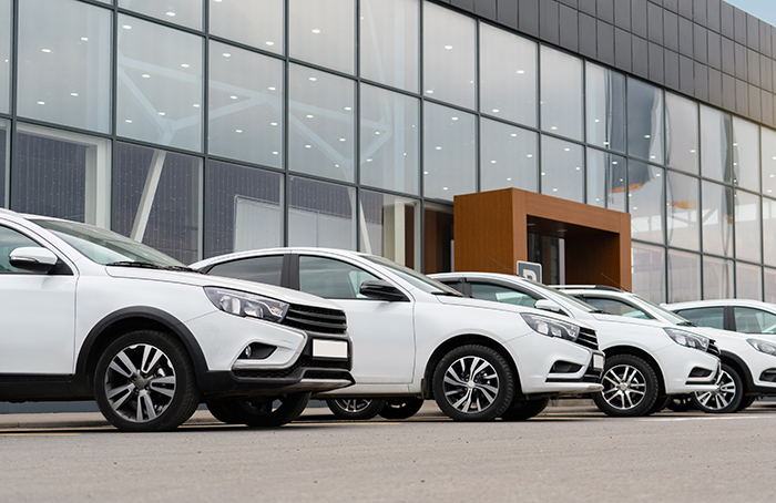 Front of a Dealership with Cars